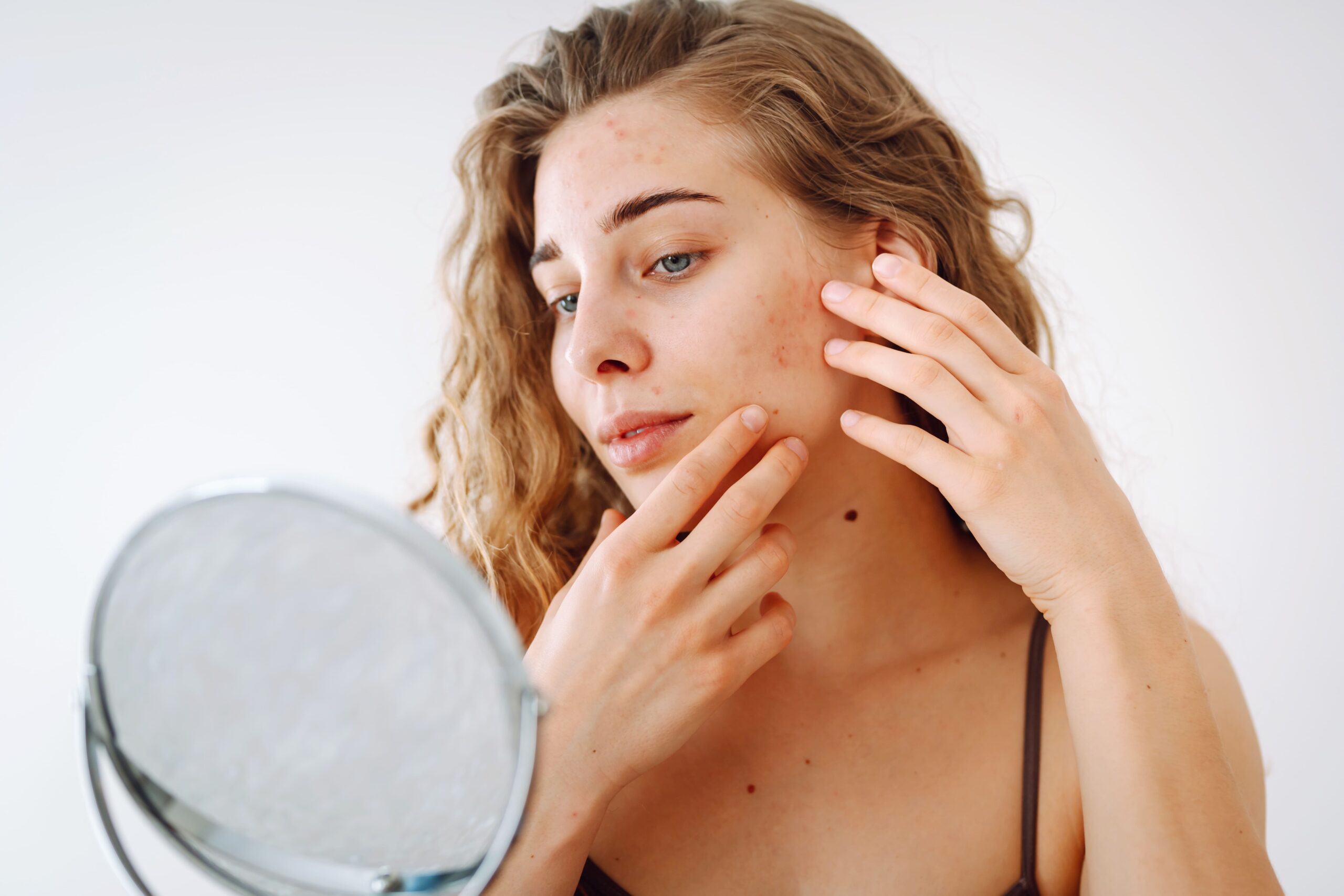 woman-examining-her-face-