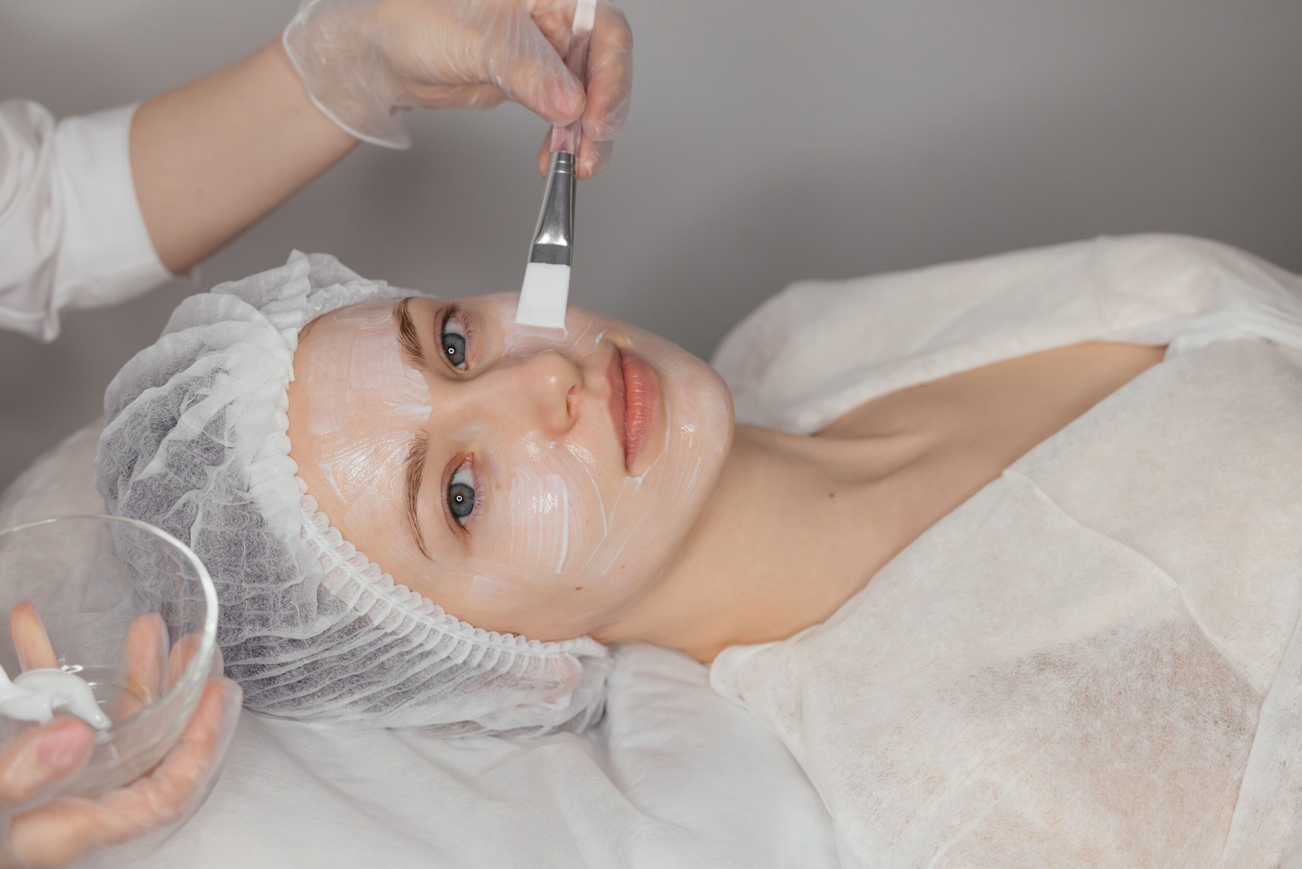 woman-receives-facial-treatment-in-spa-setting