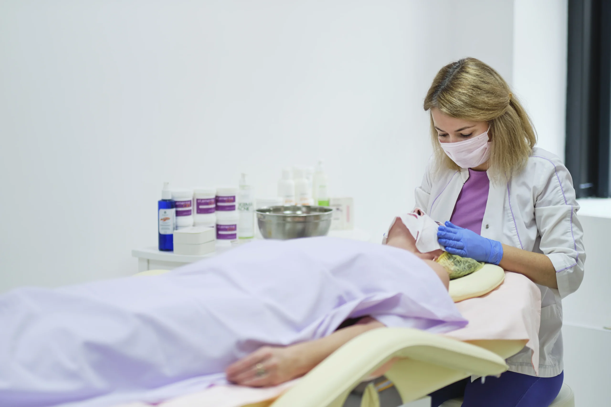 woman-receiving-facial-treatment-in-a-spa